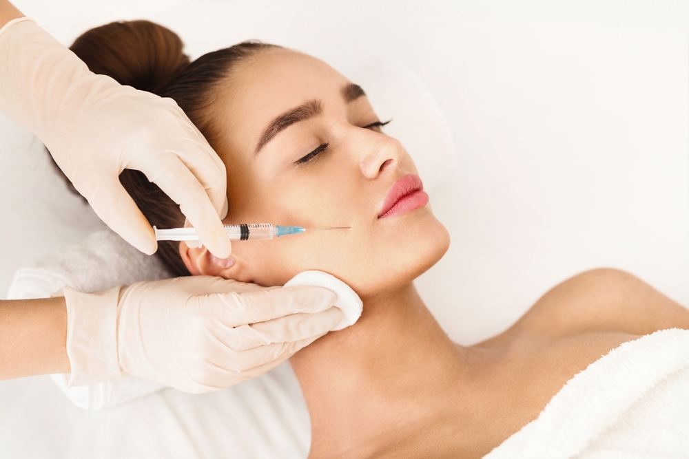 Relaxed woman getting facial filler injections in Pittsburgh, PA