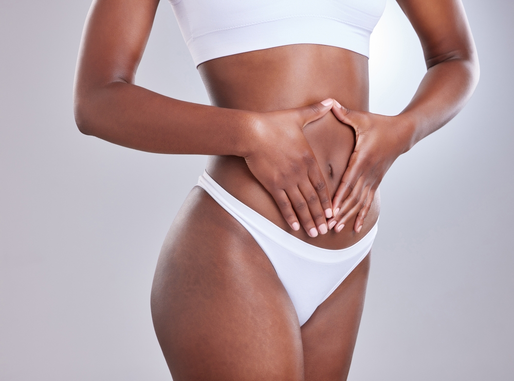 Woman with slim, toned abs from mini tummy tuck in Pittsburgh, PA